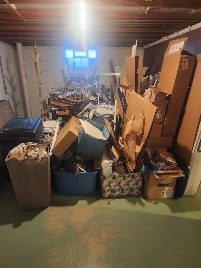 Roll-off dumpster container at job site for 8 Yard Dumpster Rental in Milton